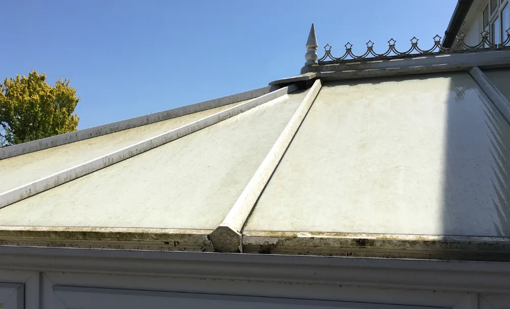Stained, cloudy conservatory roof before cleaning
