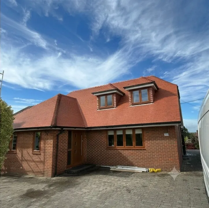 The same house with its roof cleaned back to red