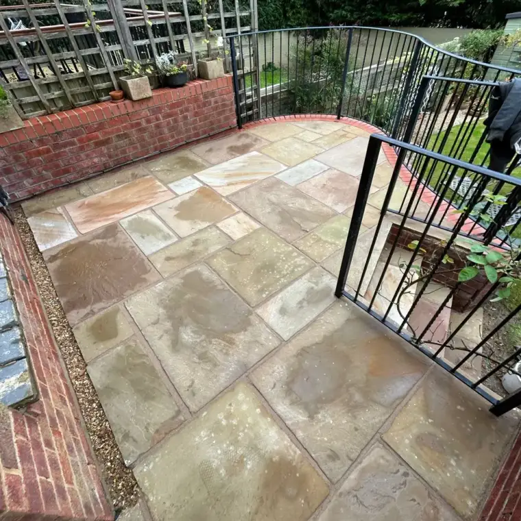 The same patio slabs after pressure washing